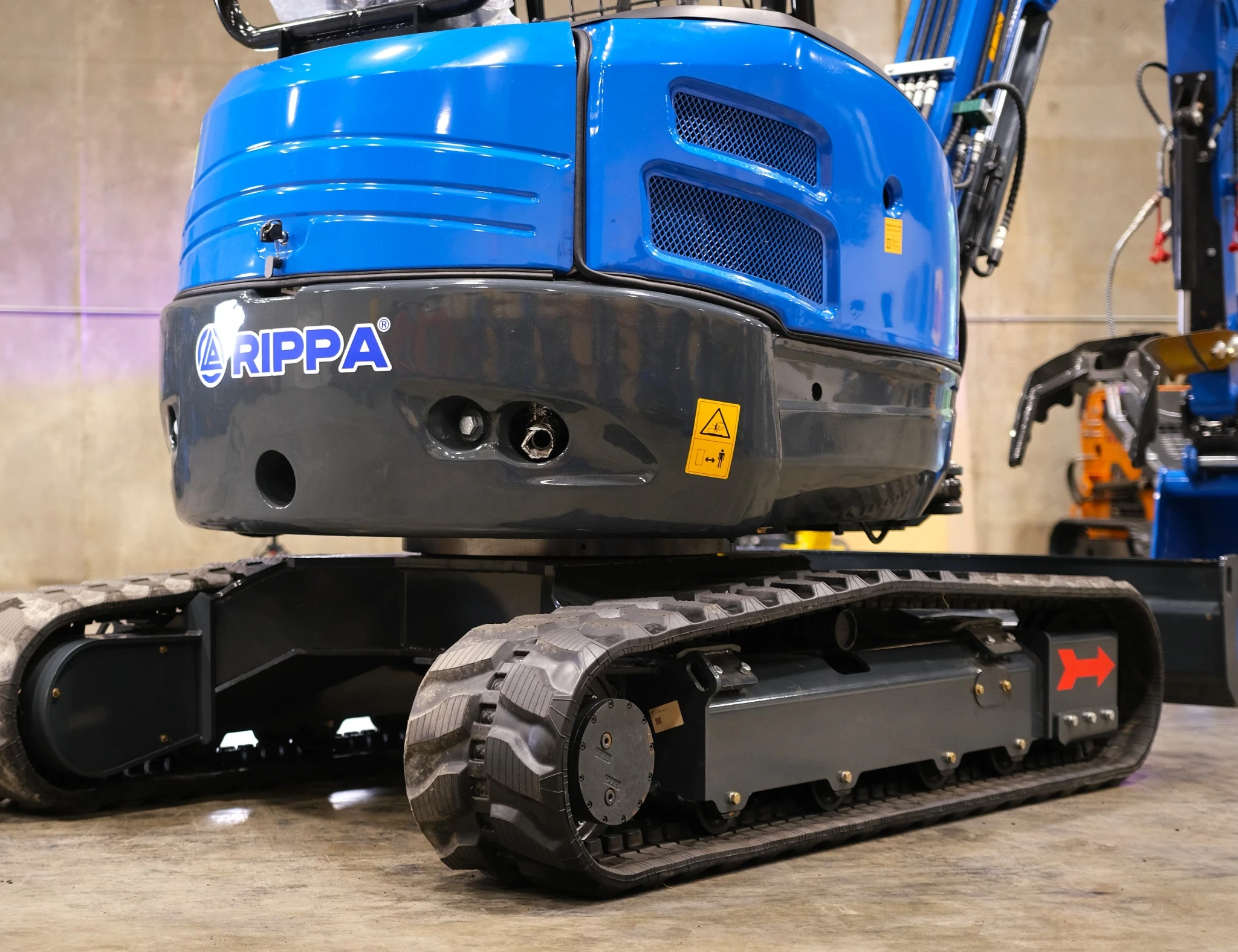 Close-up of R32 Pro track motor with 2 drive speeds, rollers and steel track shoes.