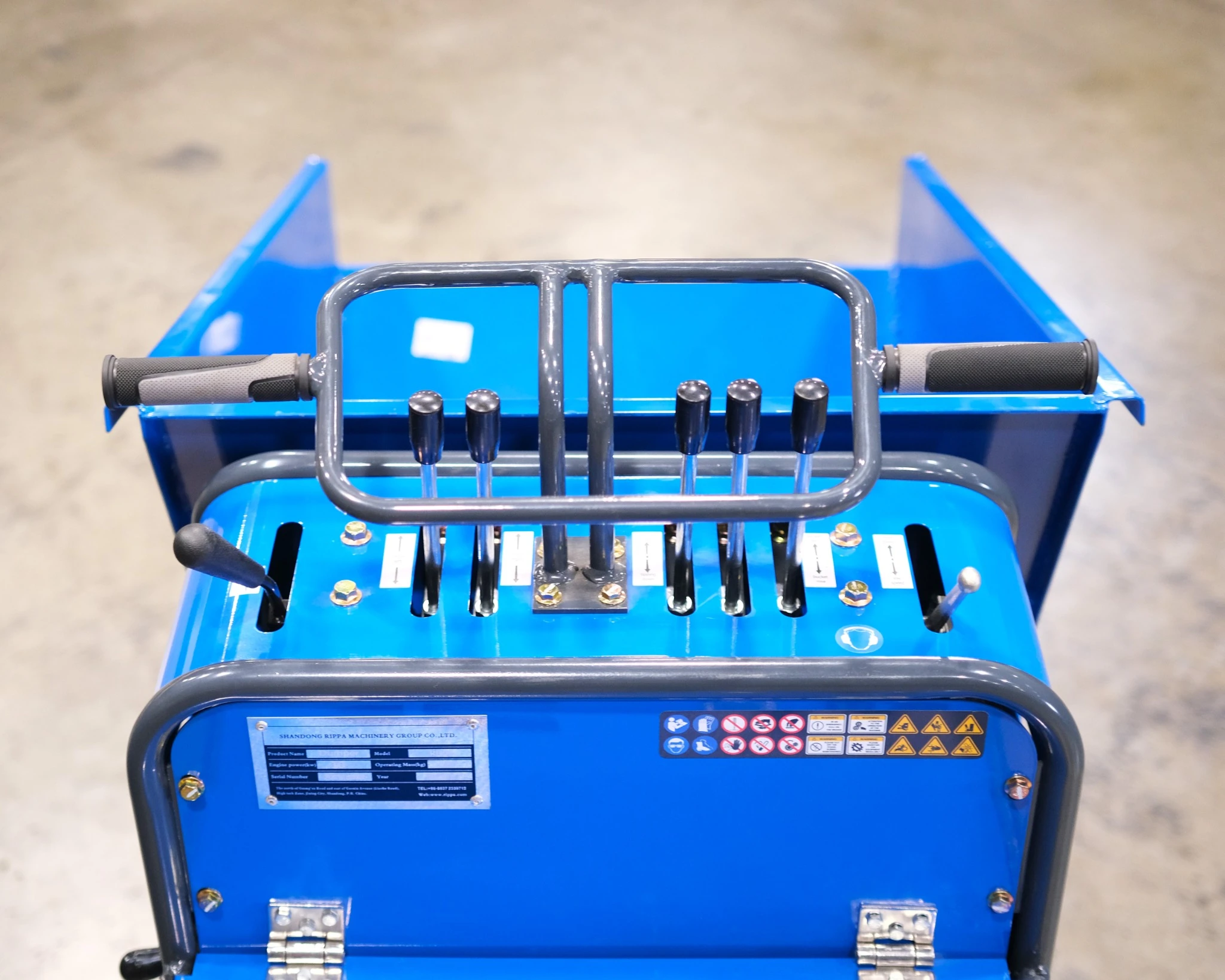 Operator control panel with multiple levers and handlebars on Rippa RD06