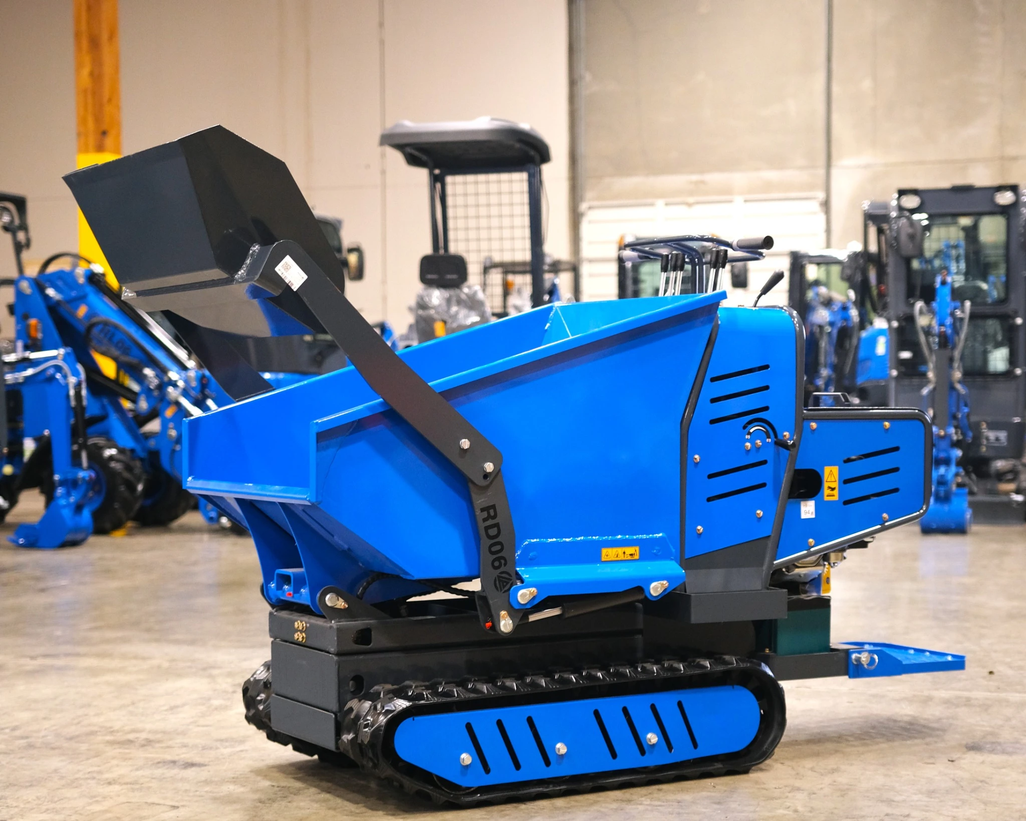 Side view of Rippa RD06 mud buggy inside warehouse with other equipment