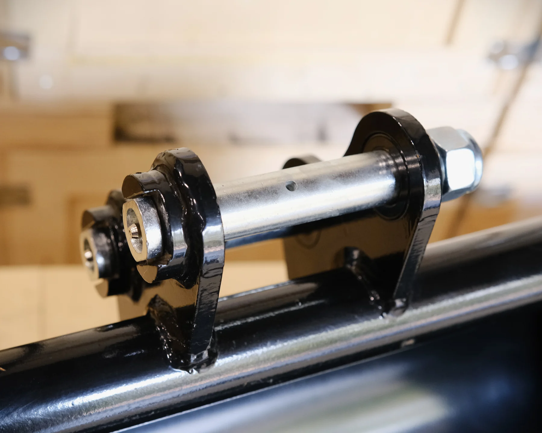 Close-up of standard 25 mm pin mount on a 24-inch mini excavator leveling bucket