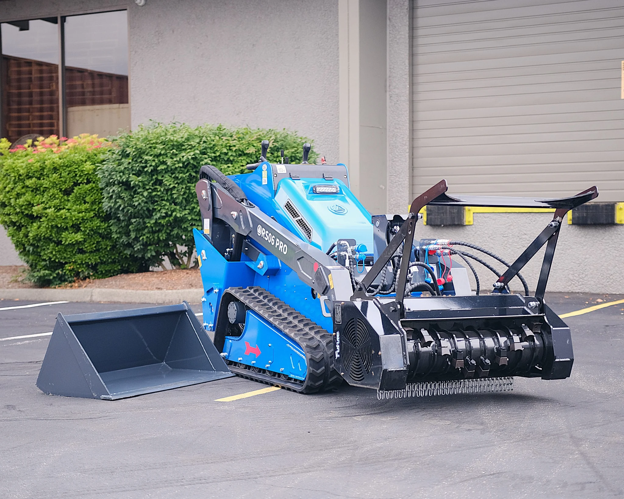 RIPPA RS06 mini skid steer with drum mulcher for brush clearing