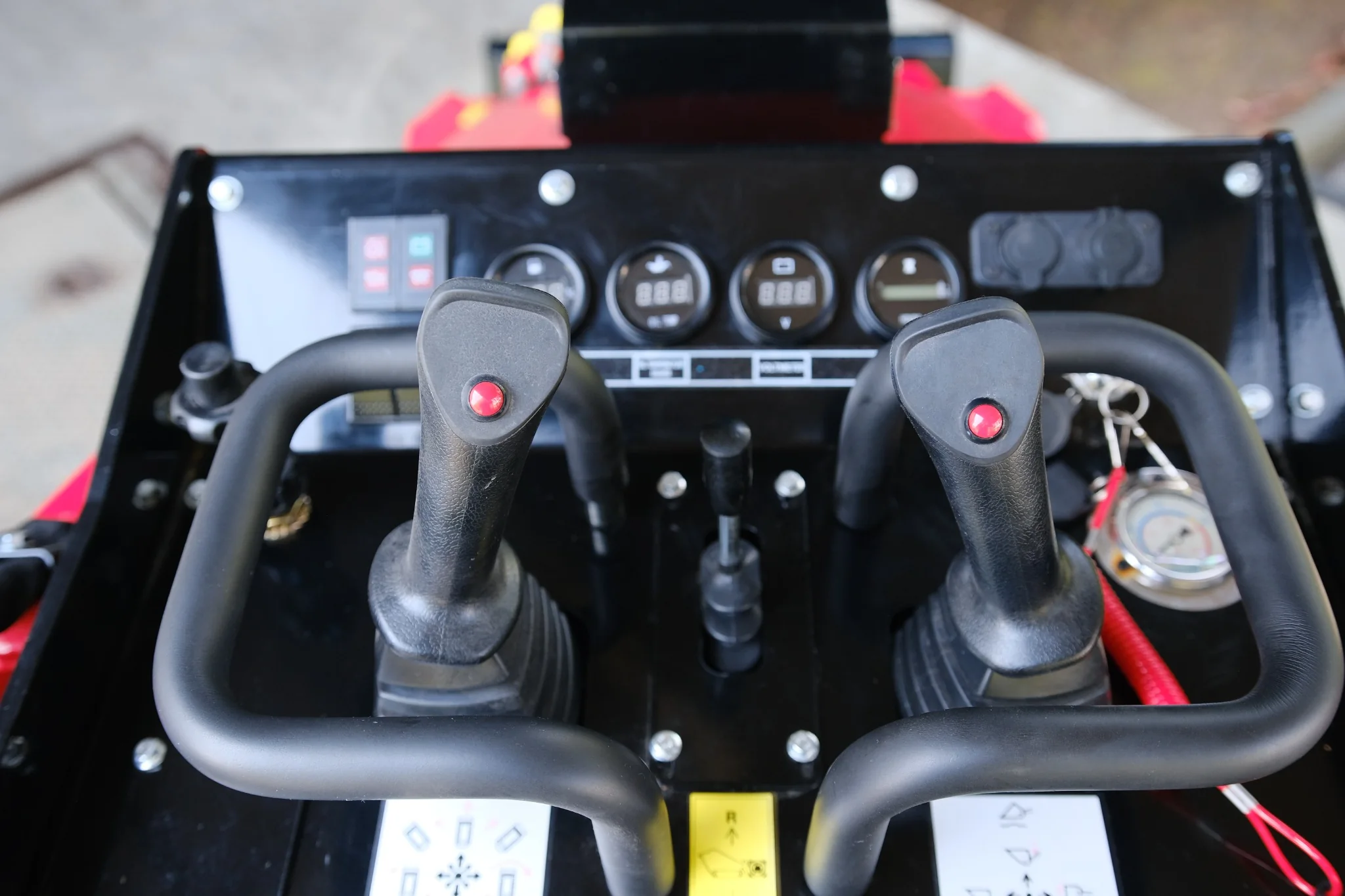 Dual joystick operator controls with gauges and safety controls on the SDLOOL SL-V1000.