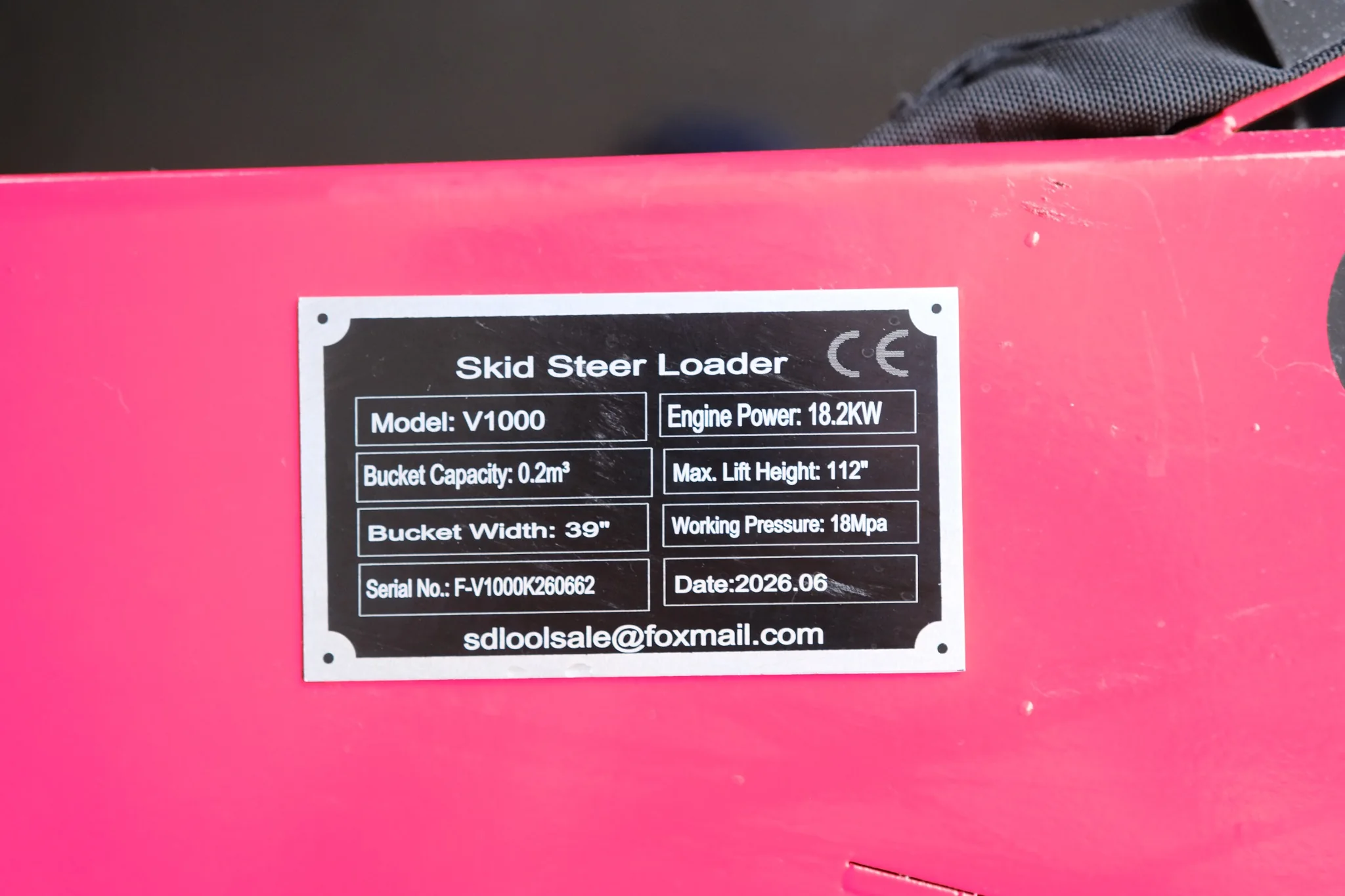 Manufacturer data plate showing model, engine power, bucket size, and specifications of the SDLOOL SL-V1000.