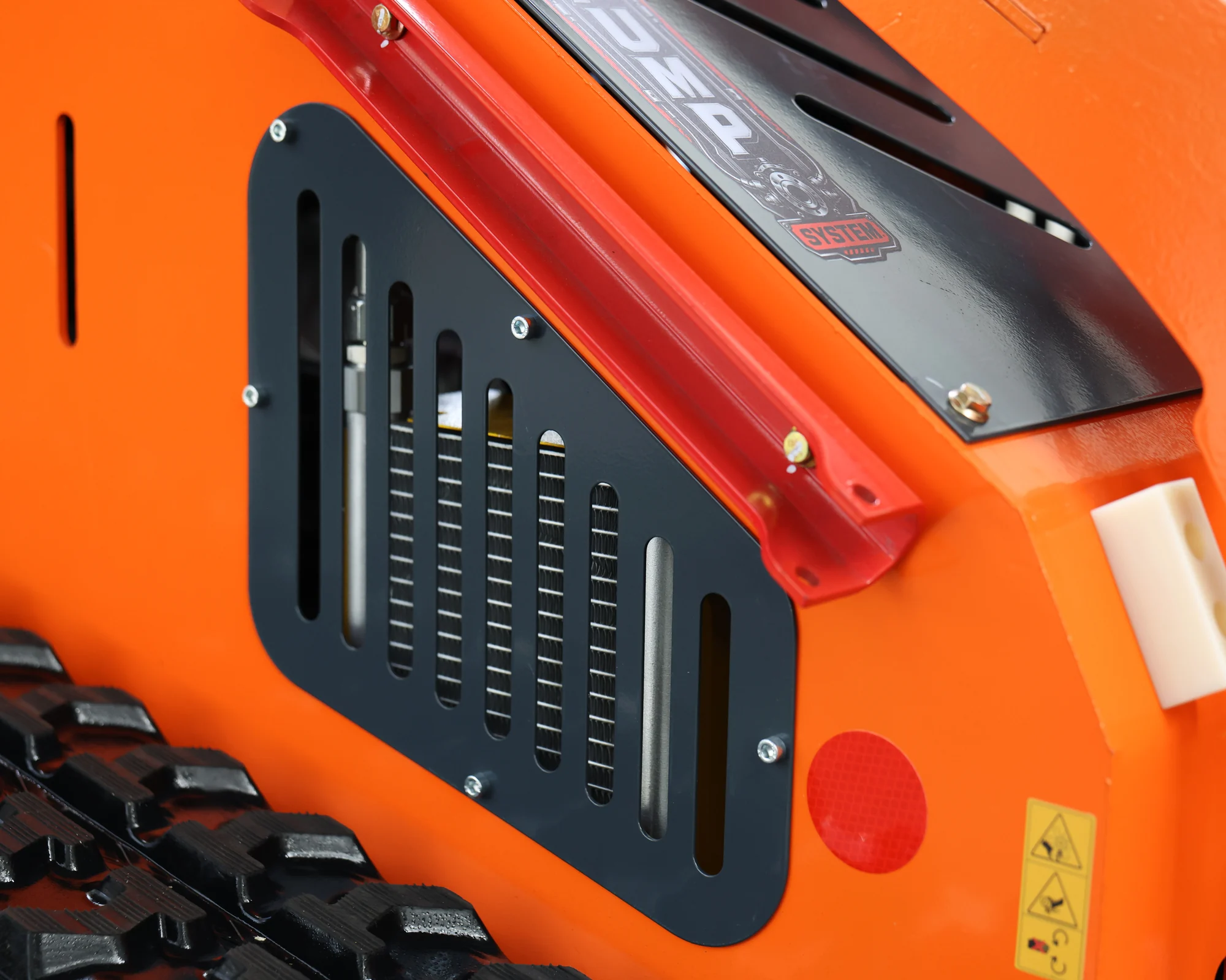 Dig Master DM24 orange mini skid steer: hydraulic oil cooler grille