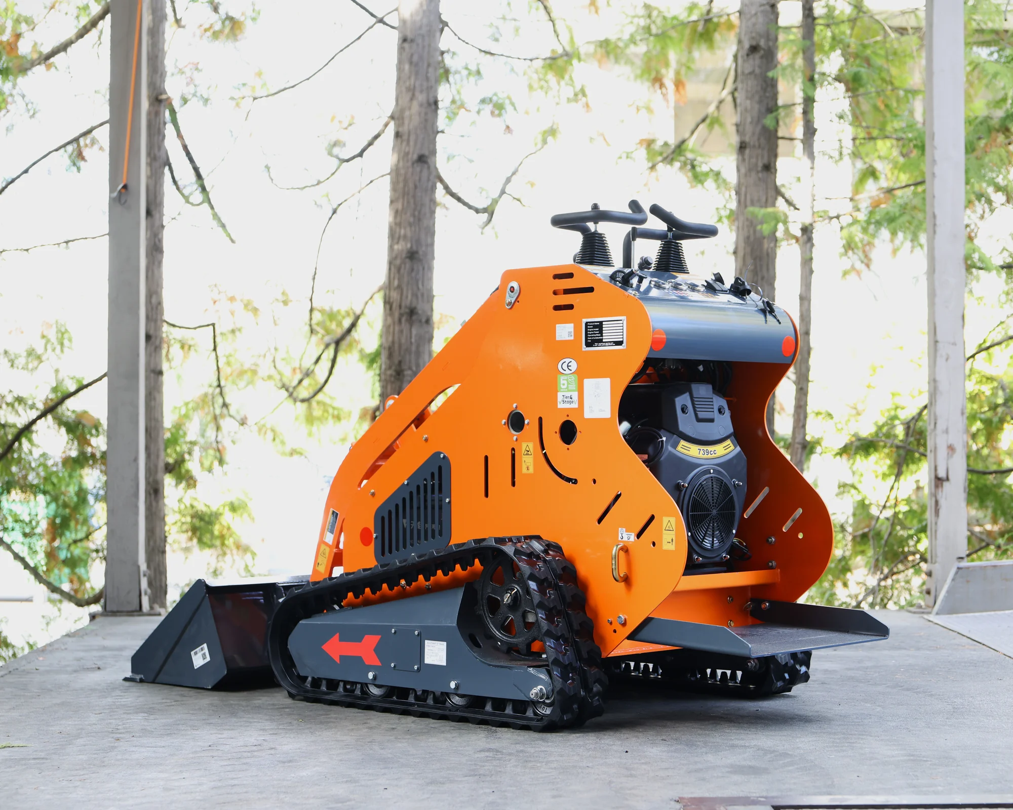 Dig Master DM24 orange mini skid steer: rear engine stand on platform